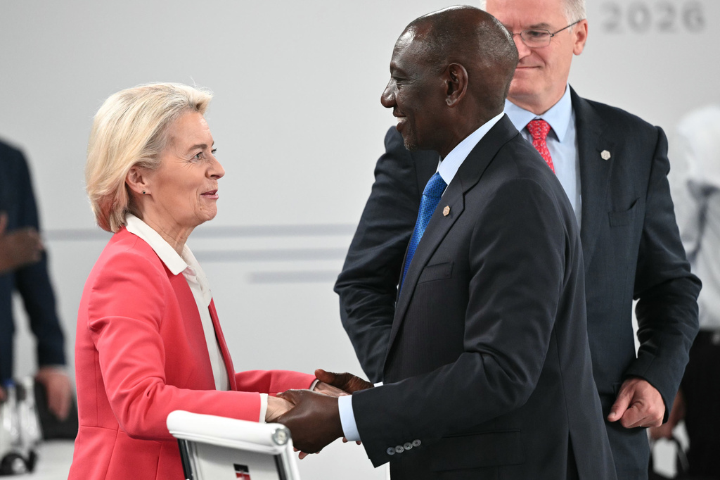 European Commission President Ursula von der Leyen, left, shakes hands with Kenya's President William Ruto ahead of a working session at the G7 summit, in Evian-les-Bains, France, Wednesday, June 17, 2026. (Mandel Ngan/Pool Photo via AP)