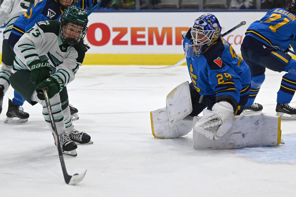 Boston Fleet's Liz Schepers (13) shoots on goal against Toronto Sceptres goaltender Elaine Chuli (29) during first-period PWHL hockey game action in Toronto, Friday, March 27, 2026. (Jon Blacker/The Canadian Press via AP)