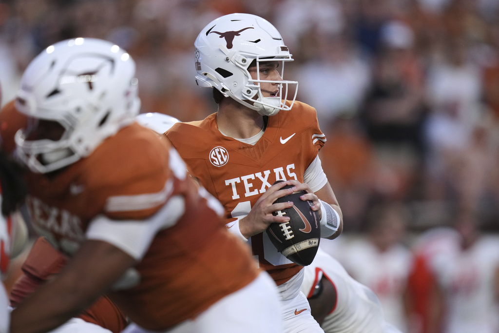 Texas quarterback Arch Manning (16) looks to pass against Sam Houston State during the first half of an NCAA college football game in Austin, Texas, Saturday, Sept. 20, 2025. (AP Photo/Eric Gay)