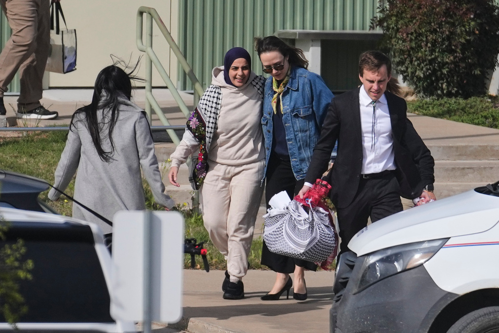 Leqaa Kordia, second from left, walks with her legal team after being released from the Prairieland Detention Center in Alvarado, Texas, Monday, March 16, 2026. (AP Photo/Tony Gutierrez)