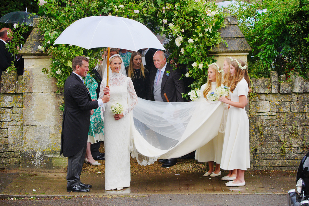Bride Harriet Sperling and bride groom Peter Phillips, accompanied by bridesmaids after their wedding ceremony at All Saints Church in Kemble, Gloucestershire, England, Saturday, June 6, 2026. (Ben Birchall/PA via AP)