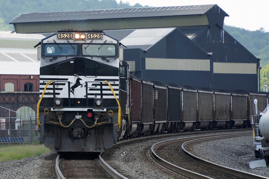 FILE - A Norfolk Southern freight train rolls past the U.S. Steel's Clairton Coke Works, in Clairton, Pa., Tuesday, Aug. 12, 2025. (AP Photo/Gene J. Puskar, File)