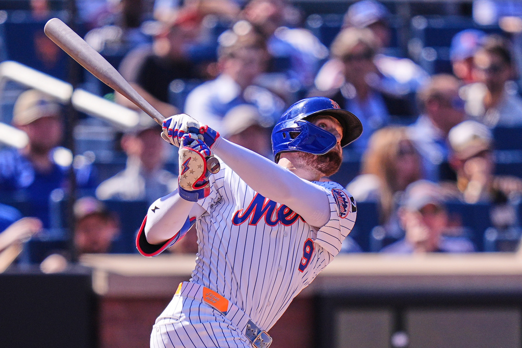 New York Mets' Brandon Nimmo looks after his three-run home run during the third inning of a baseball game against the San Diego Padres, Thursday, Sept. 18, 2025, in New York. (AP Photo/Seth Wenig)