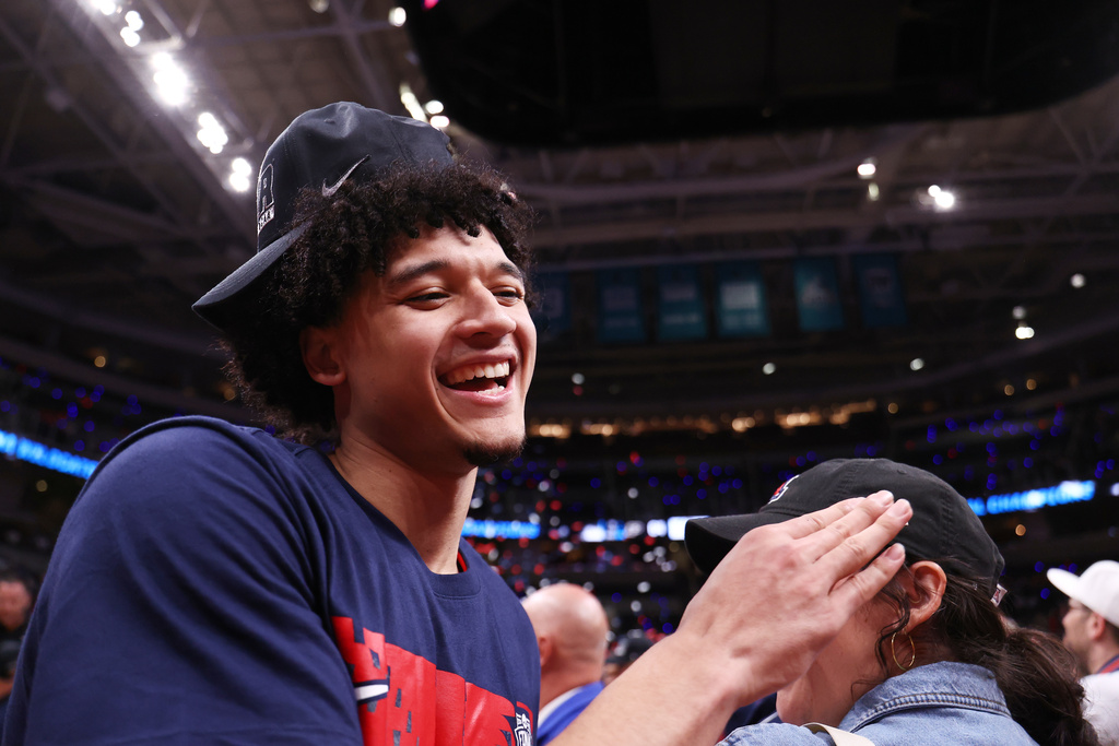 Arizona guard Brayden Burries smiles after a win over Purdue in the Elite Eight of the NCAA college basketball tournament, Saturday, March 28, 2026, in San Jose, Calif. (AP Photo/Kelley L Cox)