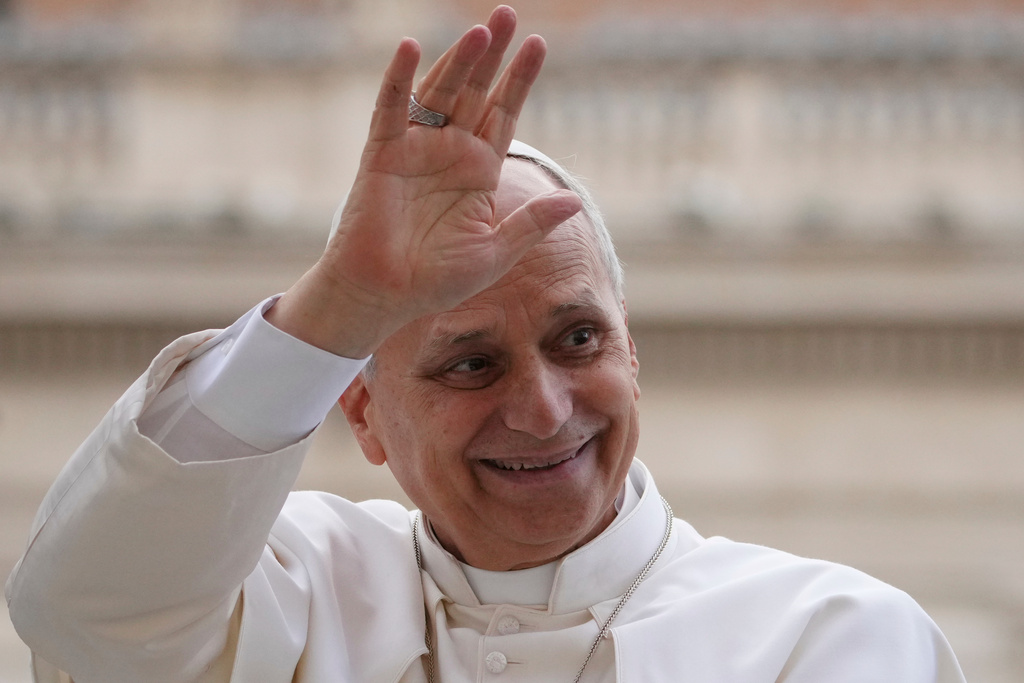 Pope Leo XIV waves as he leaves after his weekly general audience in St. Peter's Square at The Vatican, Wednesday, Dec.17, 2025. (AP Photo/Alessandra Tarantino)