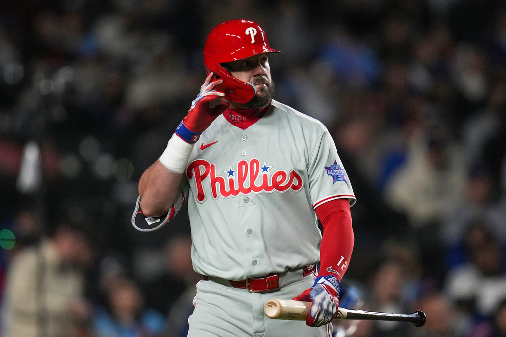 Philadelphia Phillies' Kyle Schwarber (12) returns to the dugout after striking out during the seventh inning of a baseball game against the Chicago Cubs, Wednesday, April 22, 2026, in Chicago. (AP Photo/Erin Hooley)