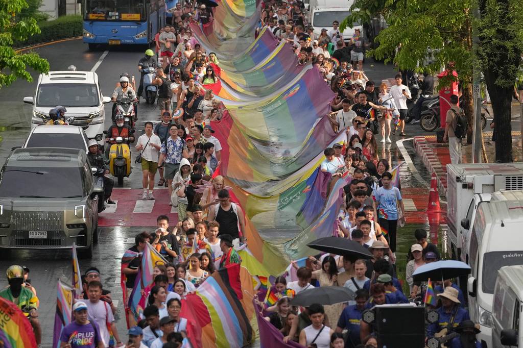 Participants hold a rainbow flag during the annual Pride Parade to celebrate the LGBTQ+ community's Pride Month in Bangkok, Thailand, Sunday, May 31, 2026. (AP Photo/Sakchai Lalit)