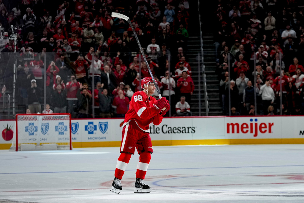 Detroit Red Wings right wing Patrick Kane celebrates after scoring his 500th career goal during the third period of an NHL hockey game against the Vancouver Canucks Thursday, Jan. 8, 2026, in Detroit. (AP Photo/Ryan Sun)