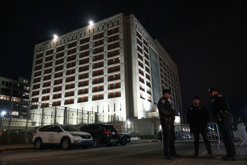 New York Police officers gather outside the Metropolitan Detention Center shortly after the arrival of captured Venezuelan President Nicolas Maduro and his wife Cilia Flores, Saturday, Jan. 3, 2026, in New York. (AP Photo/Yuki Iwamura)