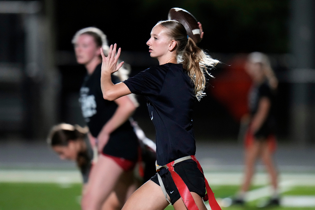Robinson High School girls flag football quarterback Paige Halverson throws a pass during a practice, Wednesday, Nov. 5, 2025, in Tampa, Fla. (AP Photo/Chris O'Meara)