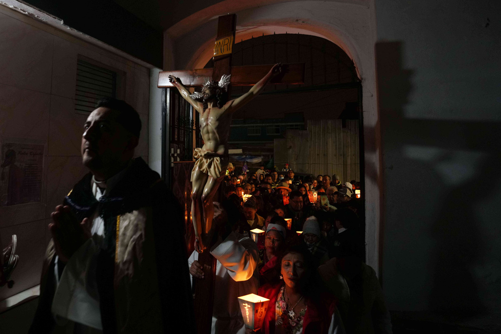 People take part in a Day of the Dead procession in Quito, Ecuador, Saturday, Nov. 1, 2025. (AP Photo/Dolores Ochoa)