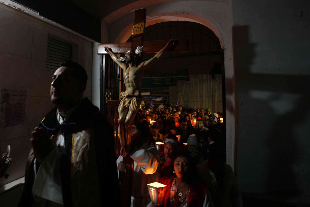 People take part in a Day of the Dead procession in Quito, Ecuador, Saturday, Nov. 1, 2025. (AP Photo/Dolores Ochoa)