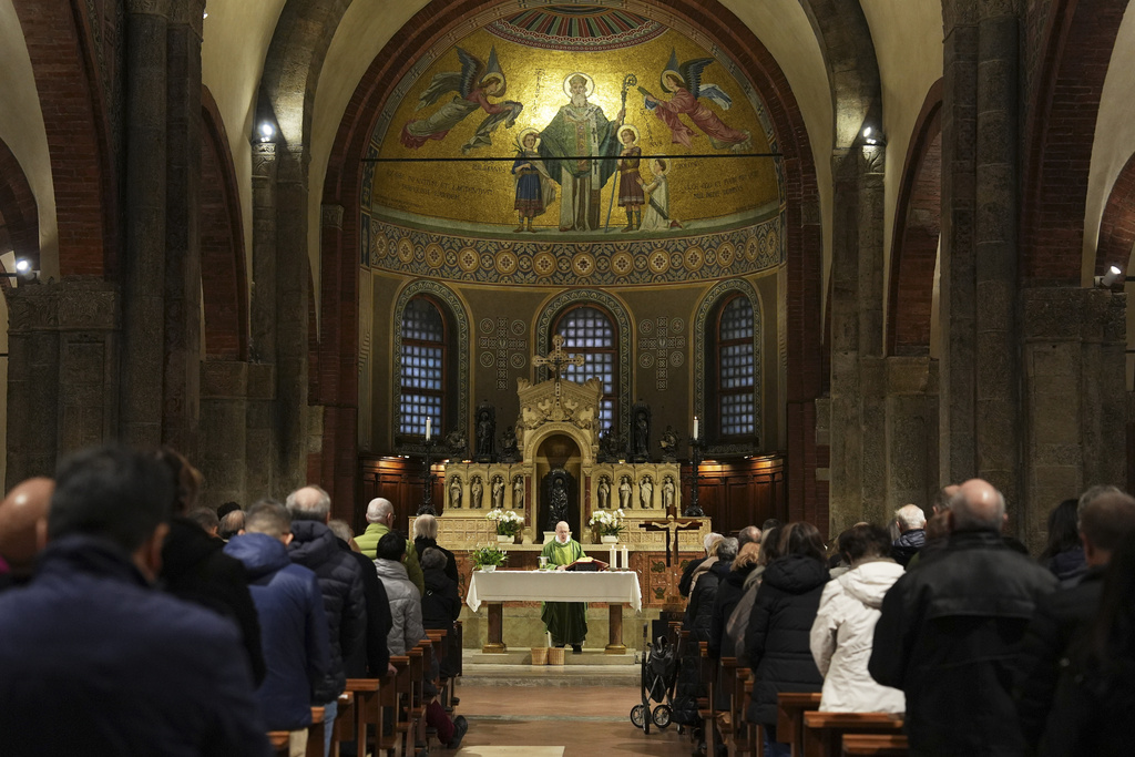 Worshippers attend one of several multilingual Masses at the Basilica of San Babila, also known as the Church of Athletes during the 2026 Winter Olympics, in Milan, Italy, Saturday, Feb. 8, 2026. (AP Photo/María Teresa Hernandez)