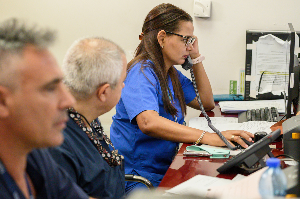 Cuban doctor Zoila Yakelin Arevalo Cruz, right, talks on the phone in the emergency unit of the Santa Maria degli Ungheresi Hospital of Polistena, in the southern Italian Calabria region, June 16, 2026. (AP Photo/Valeria Ferraro)