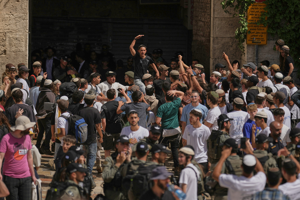 Israeli youth celebrate in Damascus Gate ahead of a march marking Jerusalem Day, a holiday celebrating the capture of east Jerusalem in the 1967 Mideast war, in Jerusalem's Old City, Thursday, May 14, 2026.(AP Photo/Leo Correa)