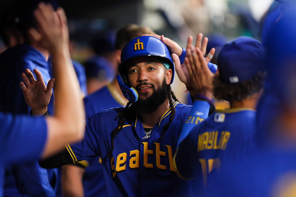 Seattle Mariners' J.P. Crawford celebrates after scoring in the sixth inning of a baseball game against the Los Angeles Angels, Thursday, July 2, 2026, in Seattle. (AP Photo/Kevin Ng)