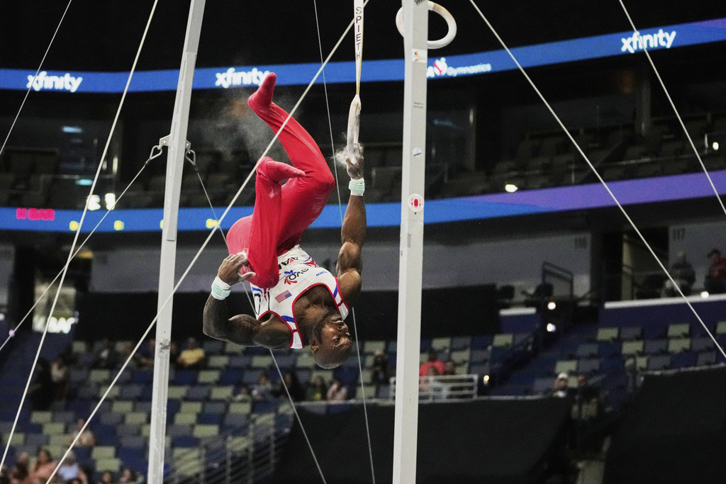 Donnell Whittenburg of EVO Gymnastics falls from the rings during the senior men's finals of the U.S. Gymnastics Championships in New Orleans, Saturday, Aug. 9, 2025. (AP Photo/Gerald Herbert)
