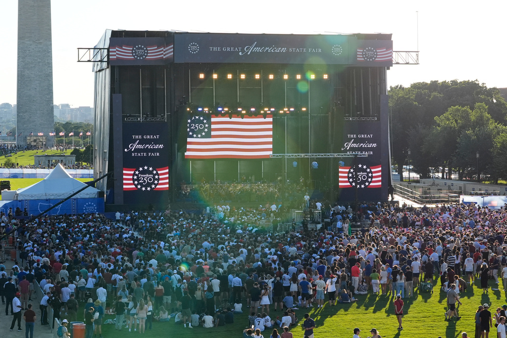People arrive before President Donald Trump speaks at the opening of the Great American State Fair on the National Mall, Wednesday, June 24, 2026, in Washington. (AP Photo/Jen Golbeck)
