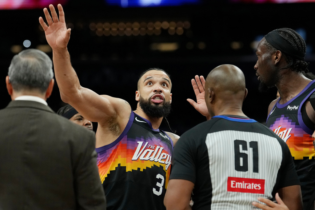 Phoenix Suns forward Dillon Brooks (3) argues with referee Courtney Kirkland (61) during the first half of an NBA basketball game, Friday, Jan. 9, 2026, in Phoenix. (AP Photo/Ross D. Franklin)