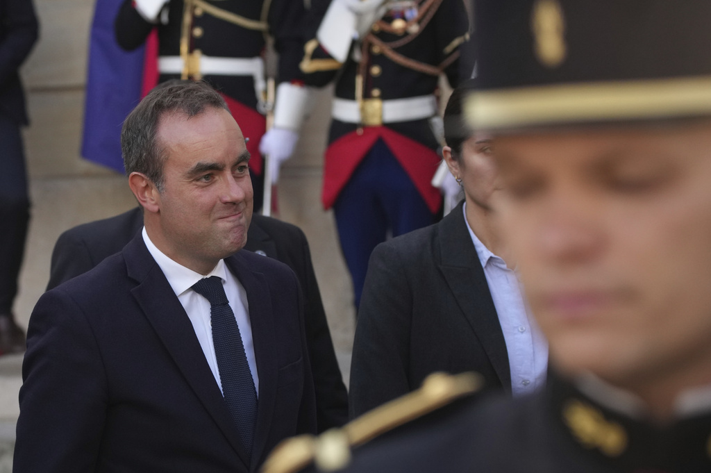 Newly named Prime Minister Sebastien Lecornu, left, smiles after a handover ceremony at the Prime Minister residence, in Paris, France, Wednesday, Sept. 10, 2025. (AP Photo/Christophe Ena)