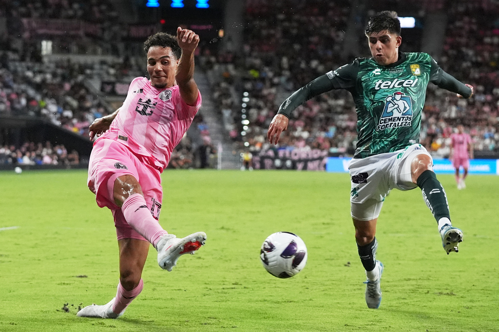 Inter Miami defender Ian Fray, left, passes the ball as Club León midfielder Sebastian Santos, right, defends during the first half of a Leagues Cup soccer match, Wednesday, Aug. 12, 2026, in Miami. (AP Photo/Lynne Sladky)