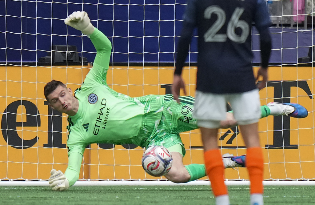 New York City FC goalkeeper Matt Freese (49) stops Vancouver Whitecaps' Brian White (not shown) during the first half of an MLS soccer match in Vancouver, British Columbia, Saturday, April 11, 2026. (Darryl Dyck/The Canadian Press via AP)
