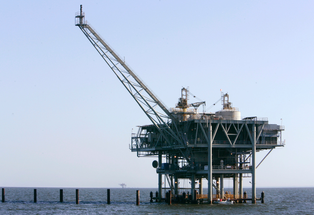 FILE - A natural gas platform is shown, April 13, 2006, off the coast of Fort Morgan, Ala. (AP Photo/Rob Carr, File)