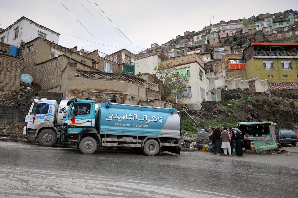 Residents collect water from a distribution truck in the Deh Mazang neighborhood in Kabul, Afghanistan, Thursday, April 2, 2026. (AP Photo/Siddiqullah Alizai)