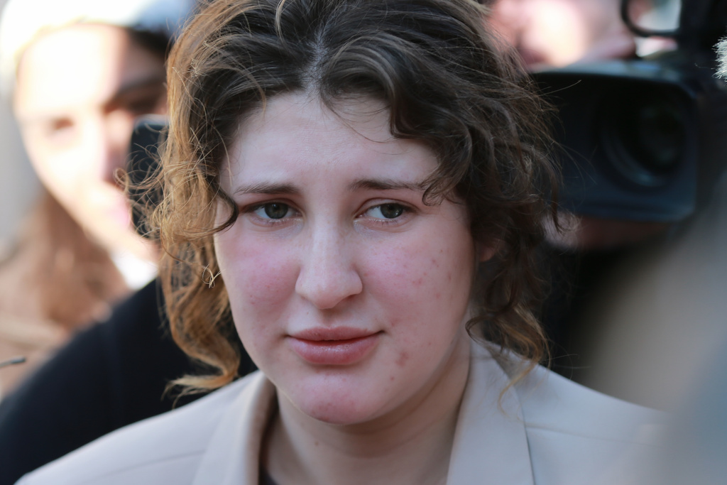 Bella May Culley, 19-year-old, who was arrested upon arrival at the Tbilisi Airport in May and accused of attempting to smuggle marijuana and hashish into the country, speaks to journalists after she was released from prison near the court building in Tbilisi, Georgia, on Monday, Nov. 3, 2025. (AP Photo/Zurab Tsertsvadze)