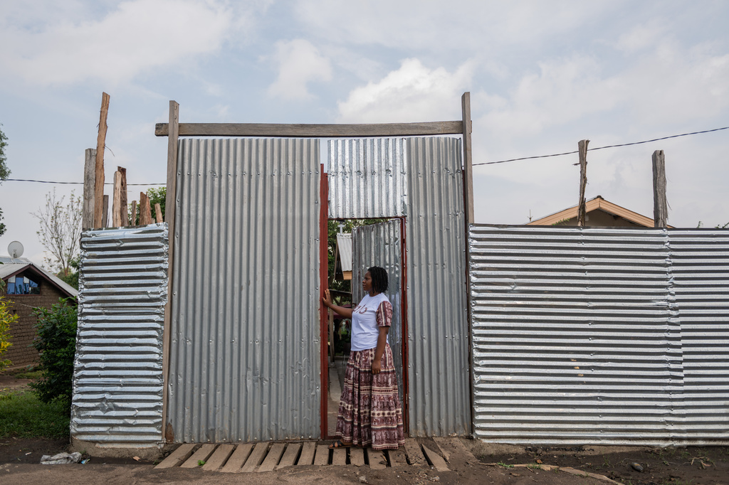 Esther Lutula, a 26 year-old woman who is four months pregnant and a mother of four, who stopped going for prenatal checkups shortly after the current Ebola outbreak, stands outside her house in Bunia, northeastern, Congo, Tuesday, June 16, 2026. (AP Photo/Moses Sawasawa)