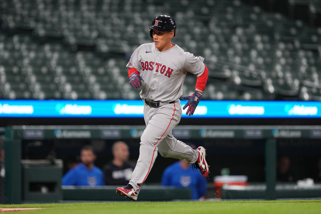 Boston Red Sox's Masataka Yoshida rounds third base on his way to score against the Detroit Tigers during the seventh inning of a baseball game Monday, May 4, 2026, in Detroit. (AP Photo/Paul Sancya)