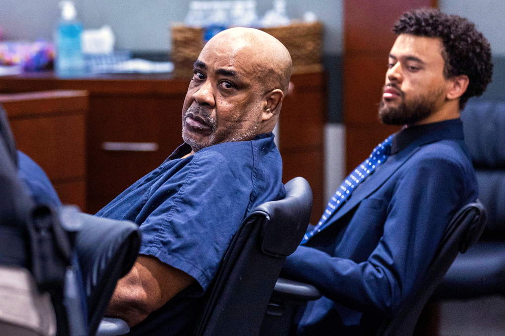 FILE - Duane Davis, left, looks back during a hearing at the Regional Justice Center, July 2, 2025, in Las Vegas. (L.E. Baskow/Las Vegas Review-Journal via AP, Pool, File)