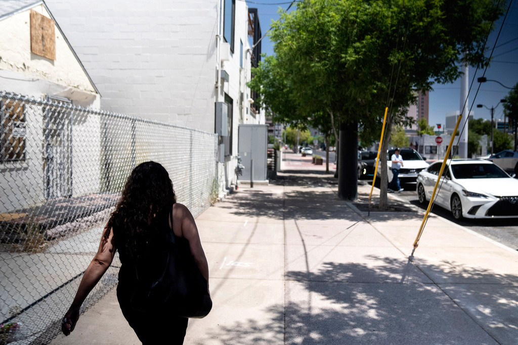 FILE - A woman adopted as a toddler by an American war veteran, who he found in the 1970s in an Iranian orphanage and raised as a Christian, walks down a Las Vegas street Wednesday, June 26, 2024. (AP Photo/David Goldman, File)
