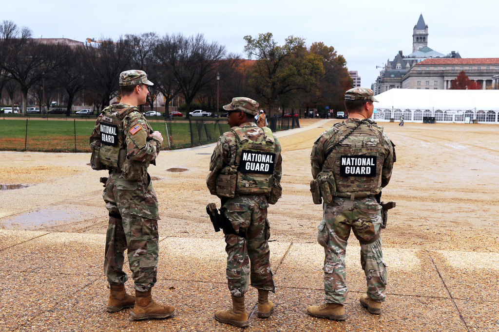 National Guard patrol on the National Mall near the U.S. Capitol, Wednesday, Nov. 26, 2025, in Washington. (AP Photo/Rahmat Gul)