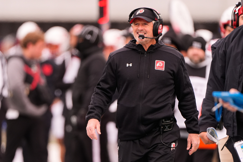 Utah head coach Kyle Whittingham watches during the first half of an NCAA college football game against Kansas, Friday, Nov. 28, 2025, in Lawrence, Kan. (AP Photo/Charlie Riedel)