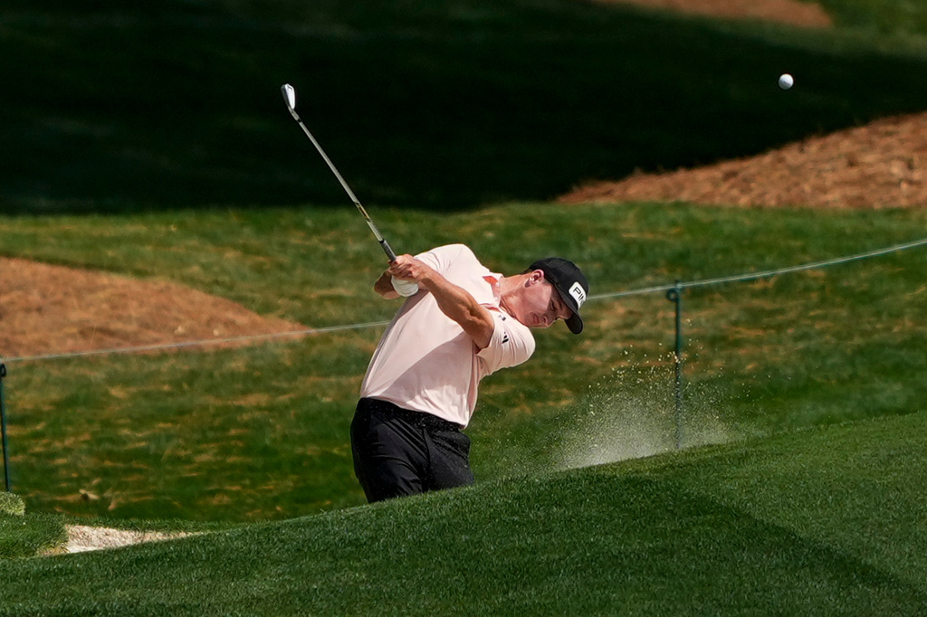 Matt McCarty hits from the 18th fairway during first round of the Truist Championship golf tournament at the Quail Hollow Club, Thursday, May 7, 2026, in Charlotte, N.C. (AP Photo/Chris Carlson)
