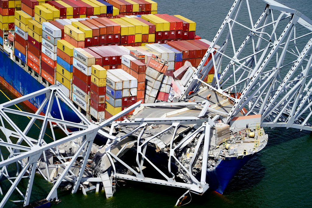FILE - In this aerial image released by the Maryland National Guard the cargo ship Dali is stuck under part of the structure of the Francis Scott Key Bridge after the ship hit the bridge, March 26, 2024, in Baltimore. (Maryland National Guard via AP, File)