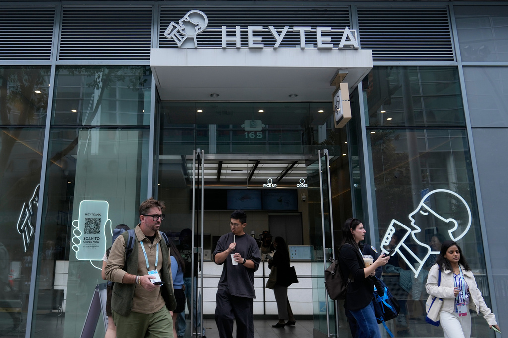 People walk outside of a HEYTEA store Wednesday, Sept. 16, 2026, in San Francisco. (AP Photo/Jeff Chiu)