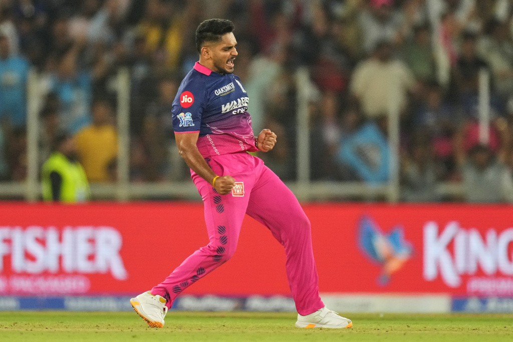 Rajasthan Royals Tushar Deshpande celebrates the wicket of Gujarat Titans' Rashid Khan during the Indian Premier League cricket match between Gujarat Titans and Rajasthan Royals in Ahmedabad, India, Saturday, April 4, 2026. (AP Photo/Ajit Solanki)