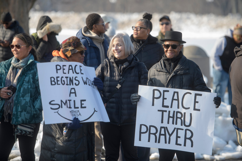 People wait for the arrival of the Buddhist monks near the Peace Monument on Capitol Hill, during the Walk for Peace, in Washington, Wednesday, Feb., 11, 2026. (AP Photo/Rod Lamkey, Jr.)