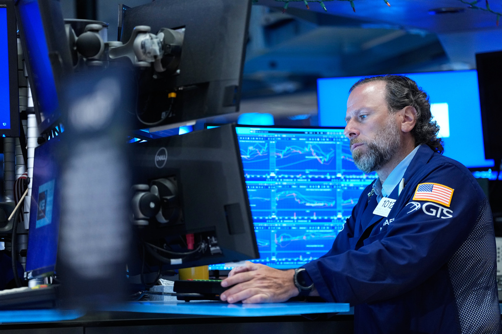 Michael Pistillo works on the floor at the New York Stock Exchange in New York, Monday, July 6, 2026. (AP Photo/Seth Wenig)