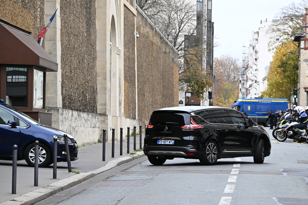 A car allegedly carrying former French President Nicolas Sarkozy leaves the Sante prison as Sarkozy is released from prison and placed under judicial supervision, Monday, Nov. 10, 2025 in Paris. (AP Photo/Emma Da Silva)
