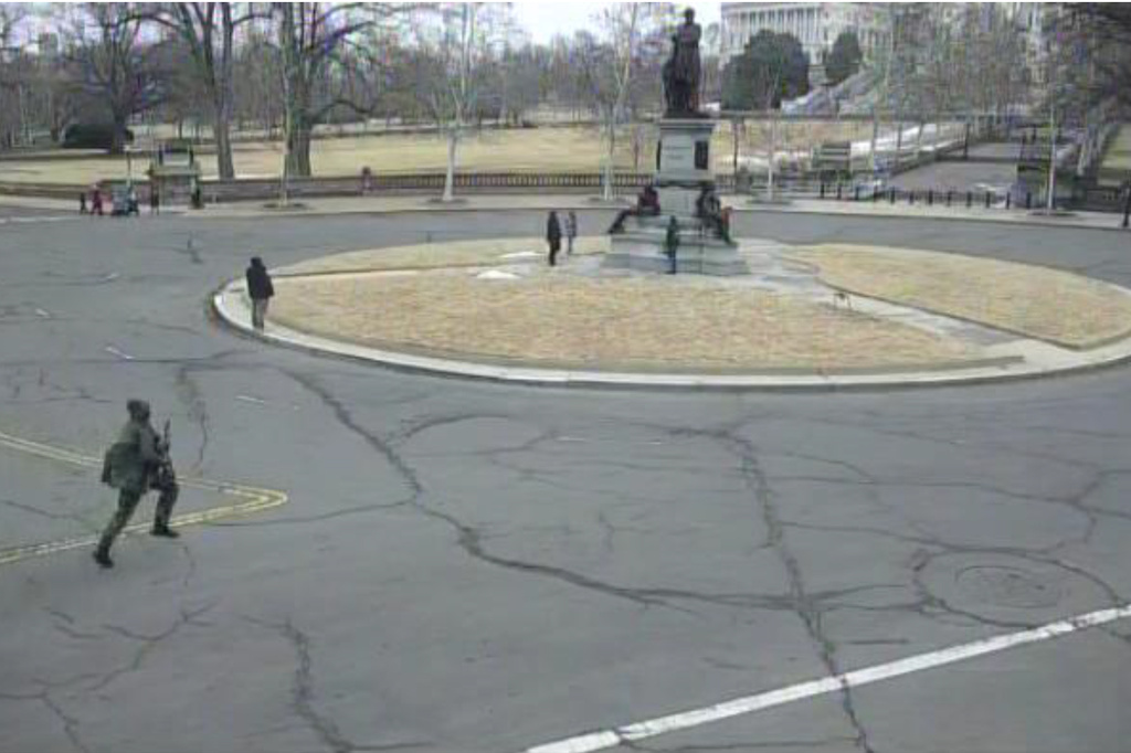 This image from video contained in the Justice Department's memorandum in support of pretrial detention of Carter Camacho, 18, shows Camacho running near the U.S. Capitol in Washington, Feb. 17, 2026. (Justice Department via AP)