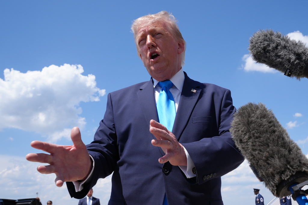 President Donald Trump speaks to the press after returning and stepping off Air Force One, Wednesday, May 20, 2026, at Joint Base Andrews, Md., after speaking at the U.S. Coast Guard Academy commencement. (AP Photo/Jacquelyn Martin)