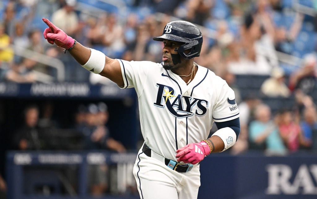 Tampa Bay Rays' Yandy Díaz celebrates as he rounds the bases after his two-run home run during the third inning of a baseball game against the Minnesota Twins Sunday, April 26, 2026, in St. Petersburg, Fla. (AP Photo/Jason Behnken)