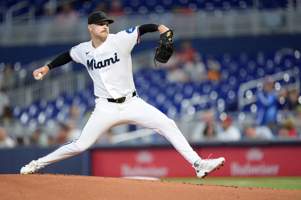 Miami Marlins starting pitcher Janson Junk pitches during the first inning of a baseball game against the St. Louis Cardinals, Wednesday, April 22, 2026, in Miami. (AP Photo/Rebecca Blackwell)