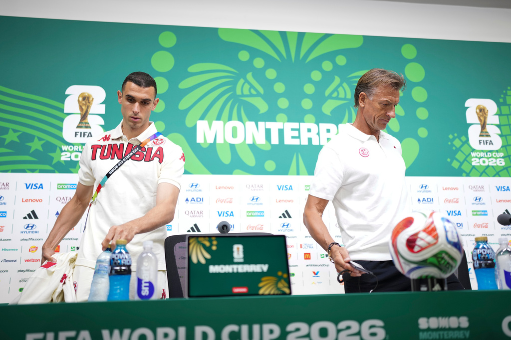 Tunisia's Ellyes Skhiri, left, and coach Herve Renard arrive a press conference ahead of their World Cup Group F soccer match against Japan in Guadalupe, near Monterrey, Mexico, Friday, June 19, 2026.(AP Photo/Matias Delacroix)