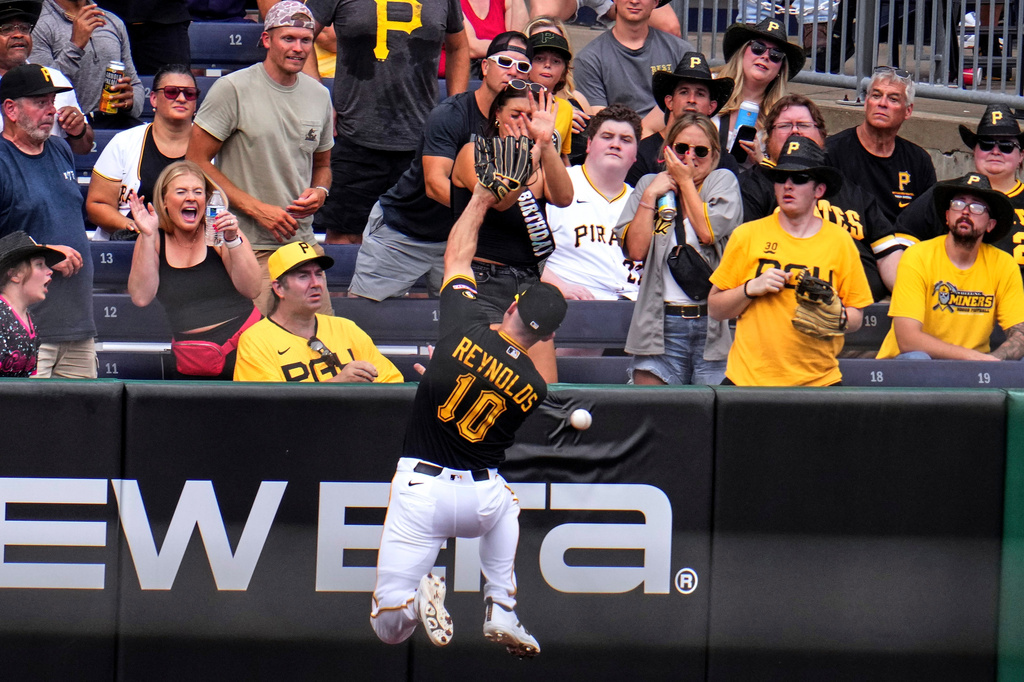 Pittsburgh Pirates left fielder Bryan Reynolds (10) cannot catch a fly ball hit for a double by Milwaukee Brewers' Brice Turang off Pirates pitcher Bubba Chandler, driving in two runs, during the fifth inning of the second game of a baseball doubleheader in Pittsburgh, Saturday, July 11, 2026. (AP Photo/Gene J. Puskar)