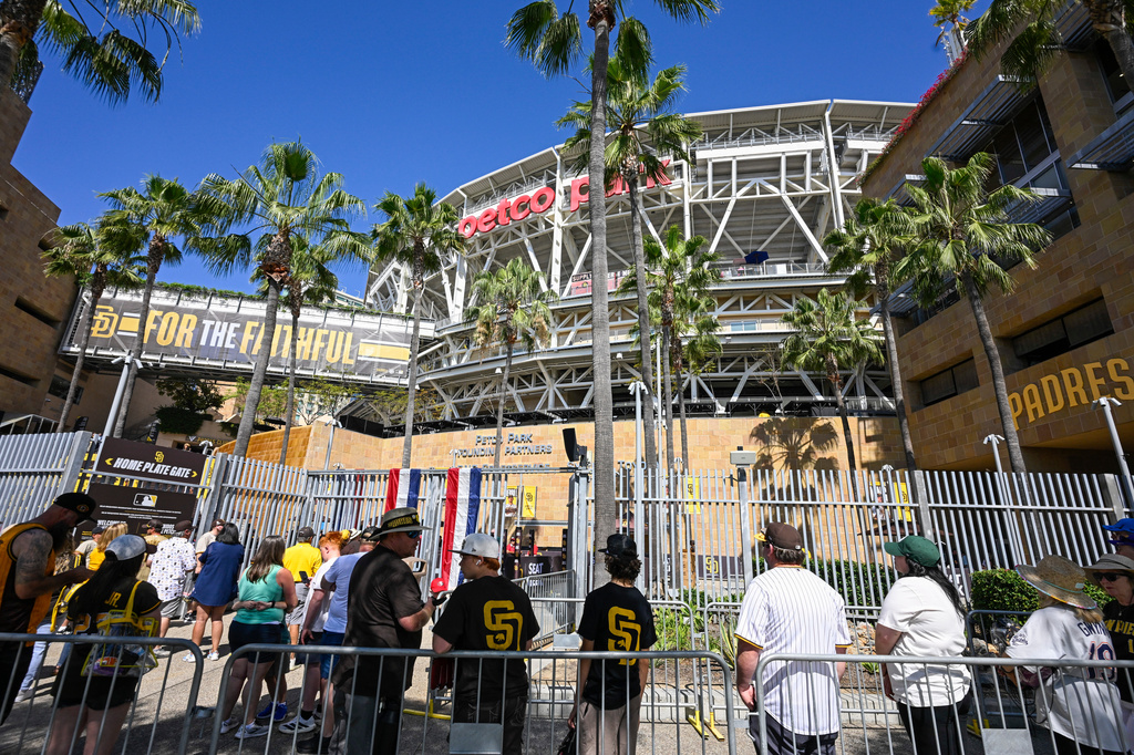 Fans line-up at Petco Park for an opening-day baseball game between the Detroit Tigers and the San Diego Padres Thursday, March 26, 2026, in San Diego. (AP Photo/Denis Poroy)