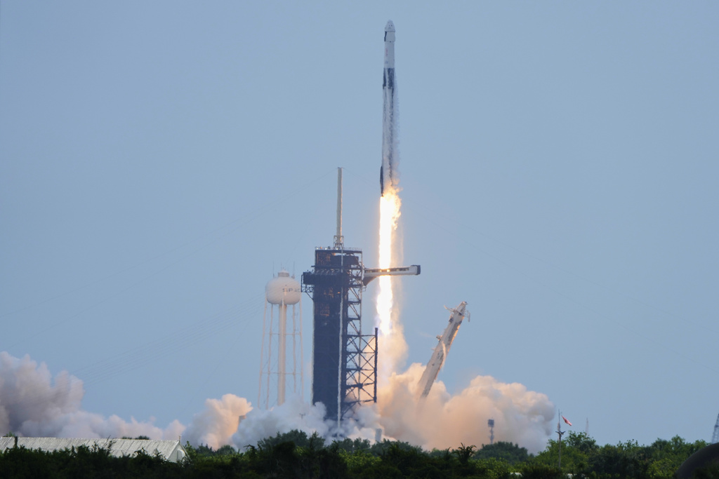 A SpaceX Falcon 9 rocket, carrying a Dragon capsule with a U.S.-Japanese-Russian crew of four, lifts off from Kennedy Space Center's Launch Pad 39-A in Cape Canaveral , Fla., on Friday, Aug. 1, 2025. (AP Photo/Chris O'Meara)